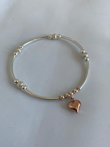 Rose gold puffed heart on sterling silver stacker bracelet 