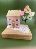 wooden hand crafted house in pink design 